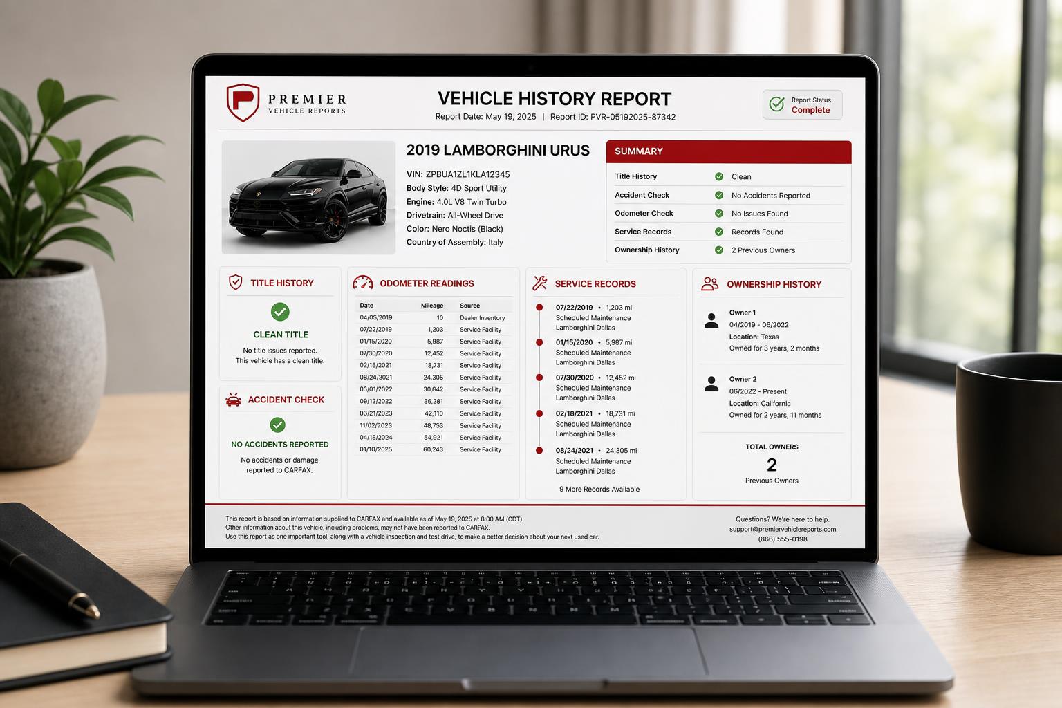 Sample Carviner vehicle history report on laptop